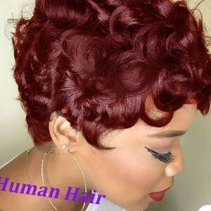 Curly/pixie short wig. Color chart shows purple but looks auburn to me